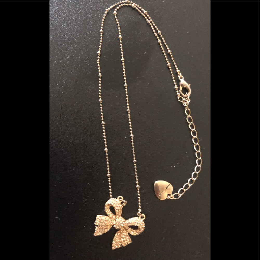 Bow gold necklace by betsey johnson